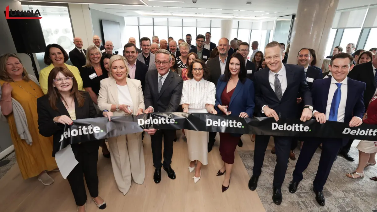 Deloitte team at a ribbon-cutting ceremony, highlighting their status as a major global consultant among mes software companies.